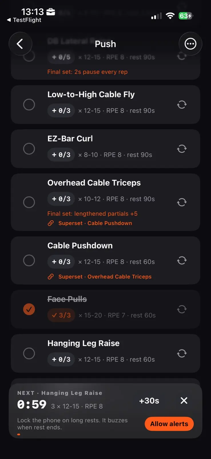 The same session part way through. Two exercises are marked as a superset and name each other, one is ticked and struck through, and a bar across the foot counts fifty nine seconds down to the next exercise, with a plus thirty seconds control beside it and a line saying the phone can be locked on long rests.