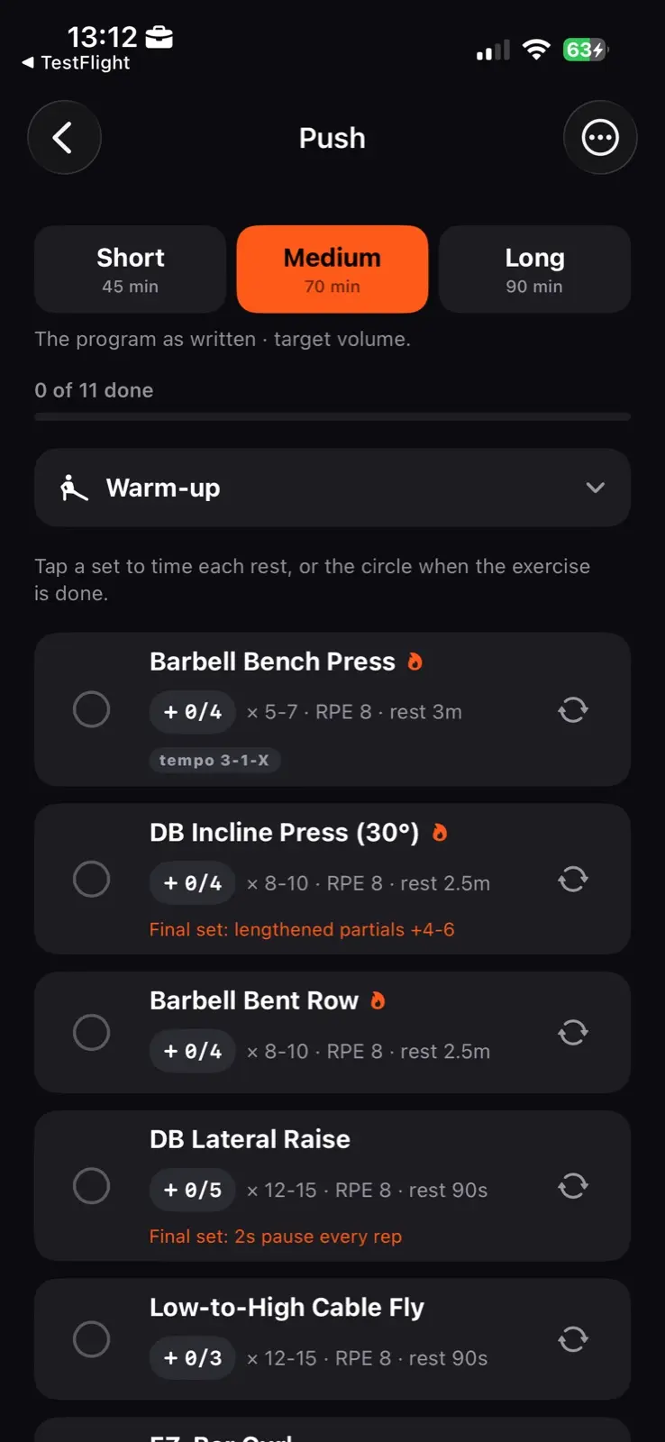The Push session. Three lengths across the top, Short at forty five minutes, Medium at seventy chosen, and Long at ninety. Under them a count reading zero of eleven done and a warm-up row. Then the exercises, each with its set count, rep range, RPE and rest, and some with a tempo or a note on the final set.