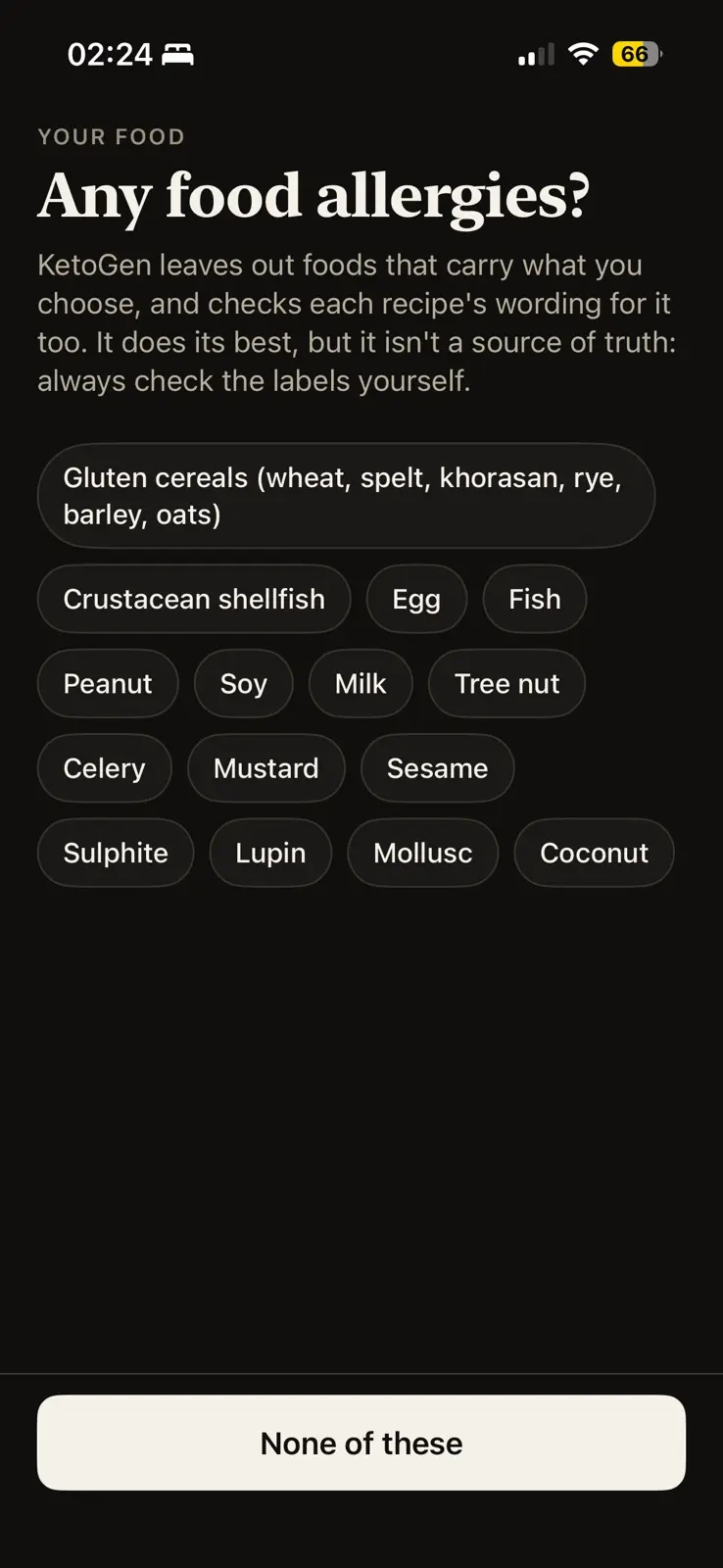Any food allergies, in dark mode. A line says KetoGen leaves out foods that carry what you choose and checks each recipe's wording for it too, but that it is not a source of truth, so always check the labels. Fifteen allergens follow as chips: gluten cereals, crustacean shellfish, egg, fish, peanut, soy, milk, tree nut, celery, mustard, sesame, sulphite, lupin, mollusc and coconut. The button reads None of these.