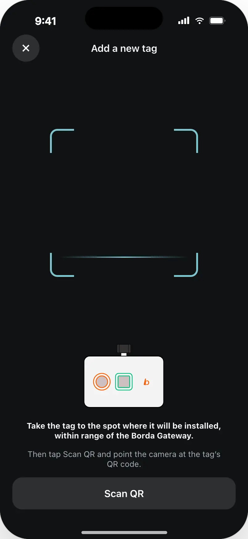 Dark scanner screen with instructions to take the tag to its install spot and scan its QR code